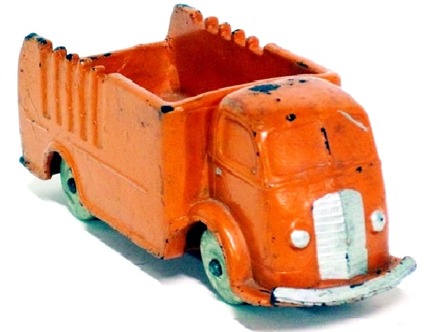 Front quarter view of an orange version of the '37 International cabover. It has white wheels.