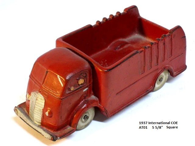 Front quarter view of a red, 1937 International cabover truck, 5 3/8 inches long. Round bumper.