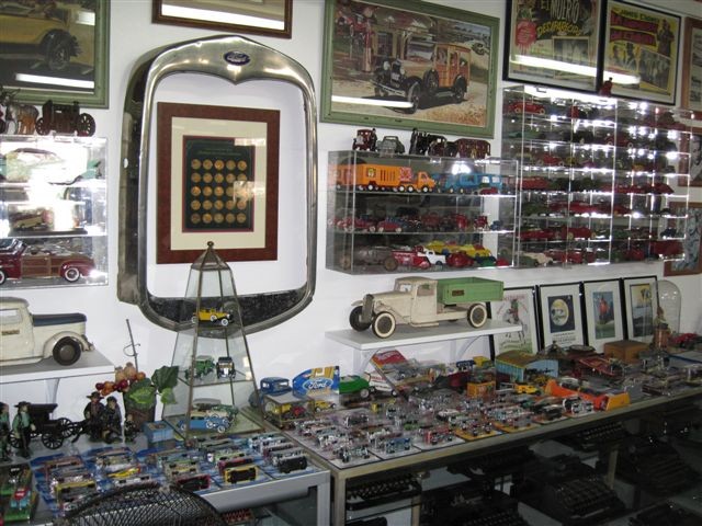 In this photo, hundreds of Hotwheels, Johnny Lightning, Matchbox are
					scattered across the top of a display case. I have almost 2000 of these and have yet to figure out how
					to display them. They have been put into storage for now.