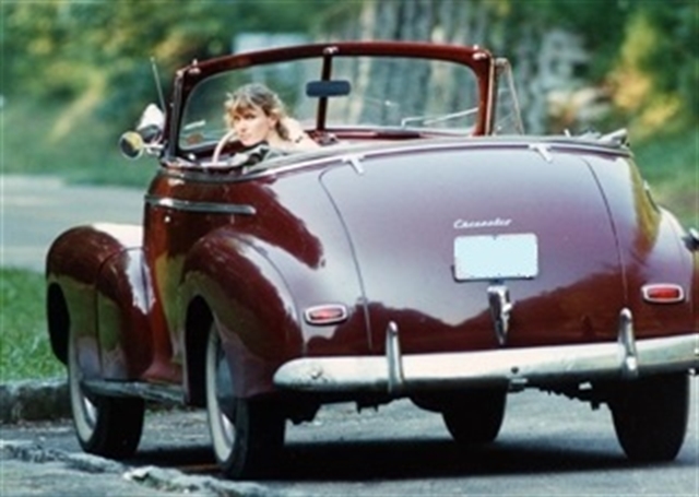 This is a rear view photo of the 1947 Chevy ragtop being driven by Elliot's lovely wife.